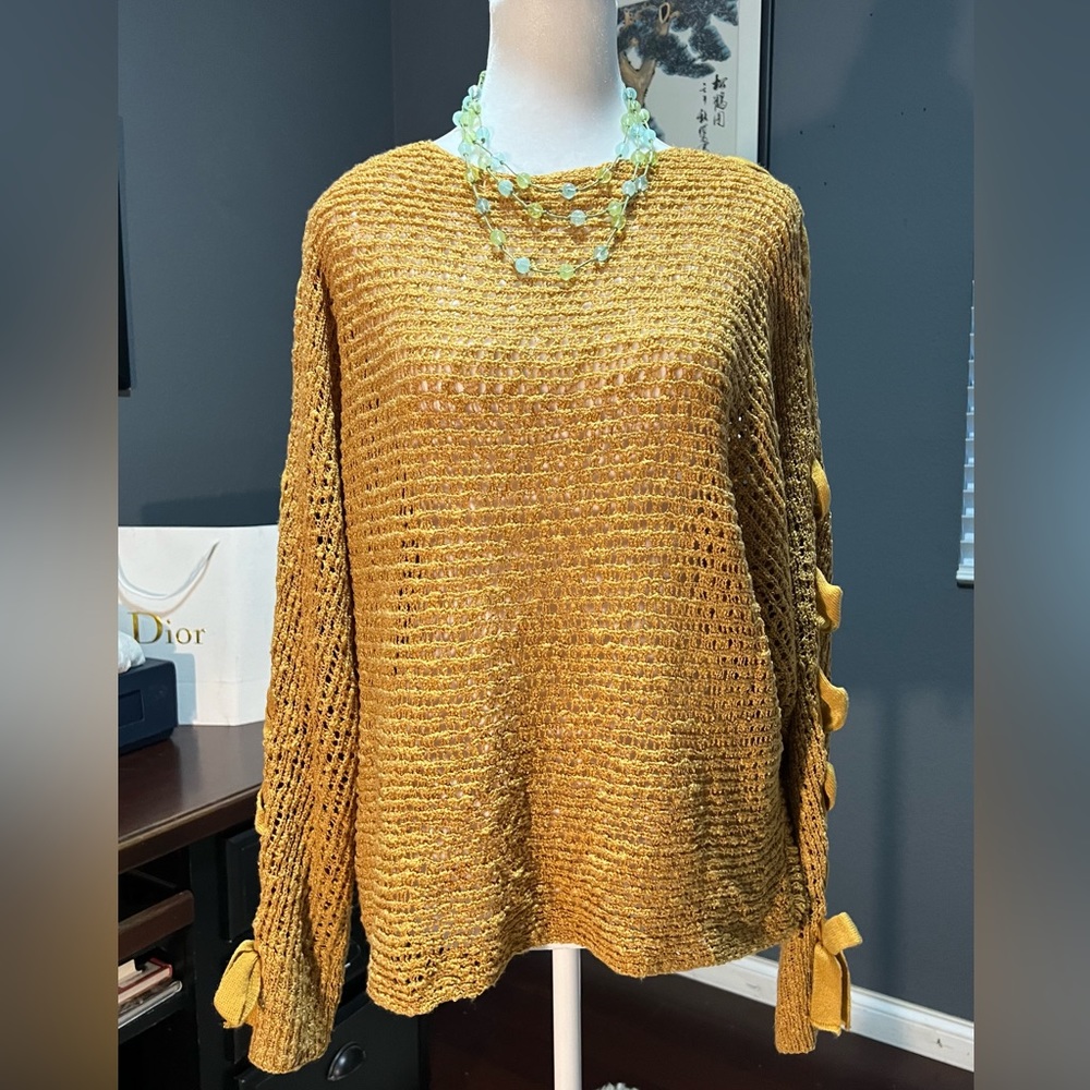 - Gold knit cardigan with tie up accent on sleeves. Perfect for any out…